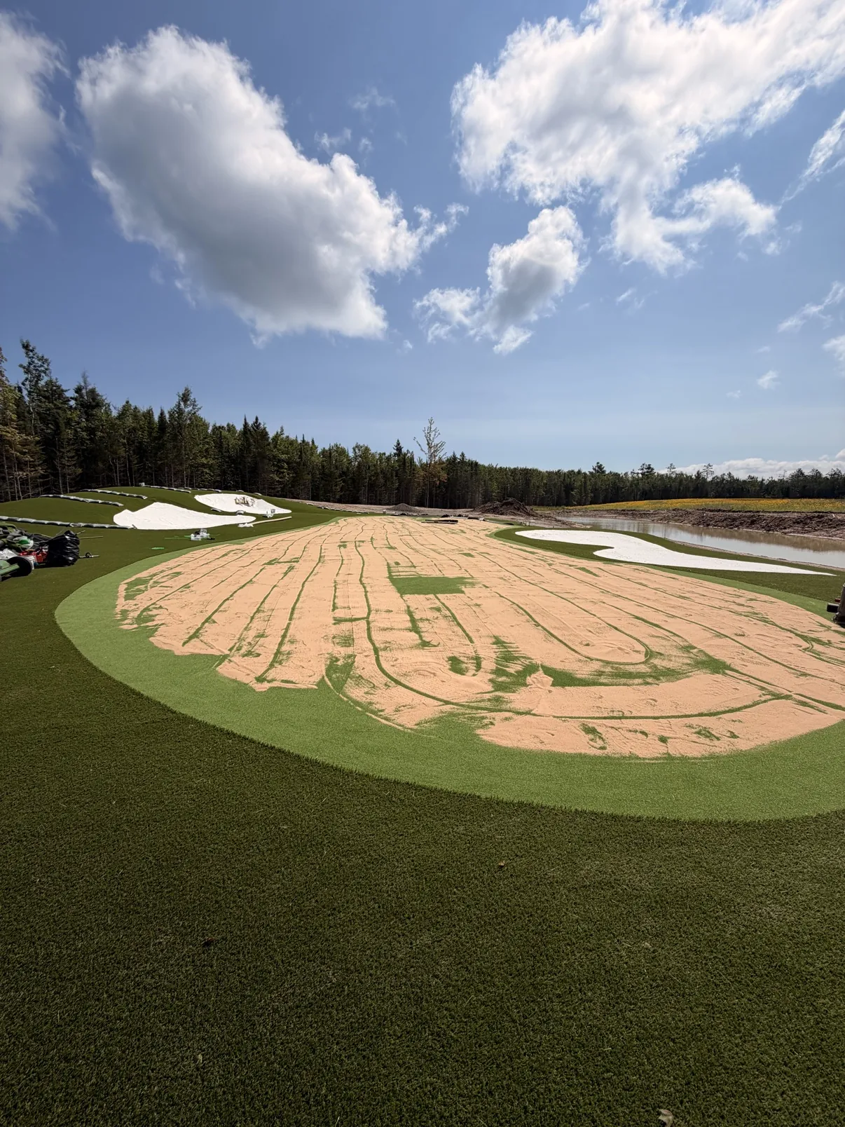 Custom backyard putting green with bunker in North Carolina
