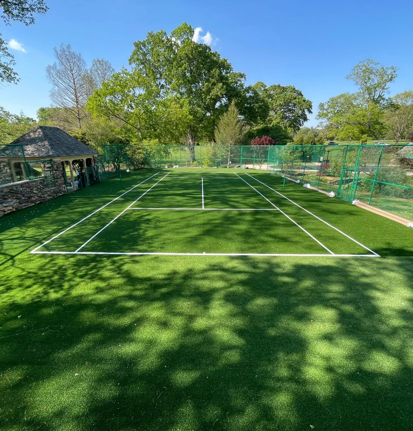 Finished synthetic turf tennis court